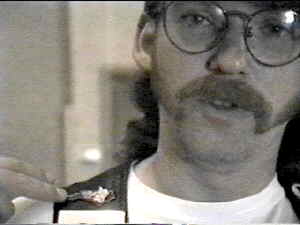 Gary H. shows the pins on his vest